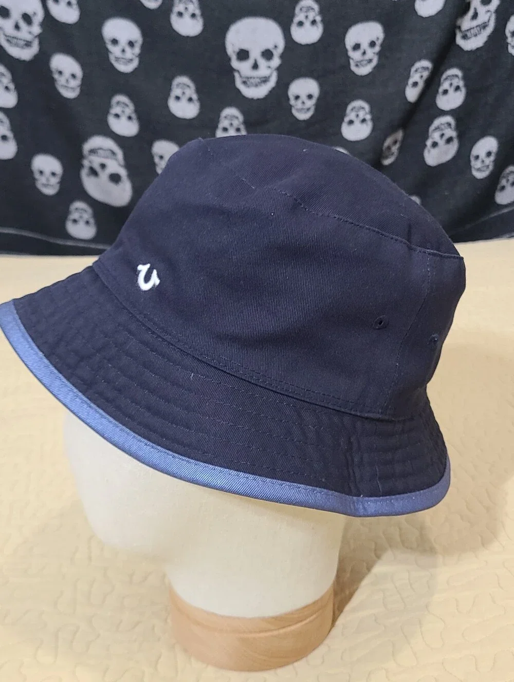 True Religion reversible embroidered logo bucket hat.